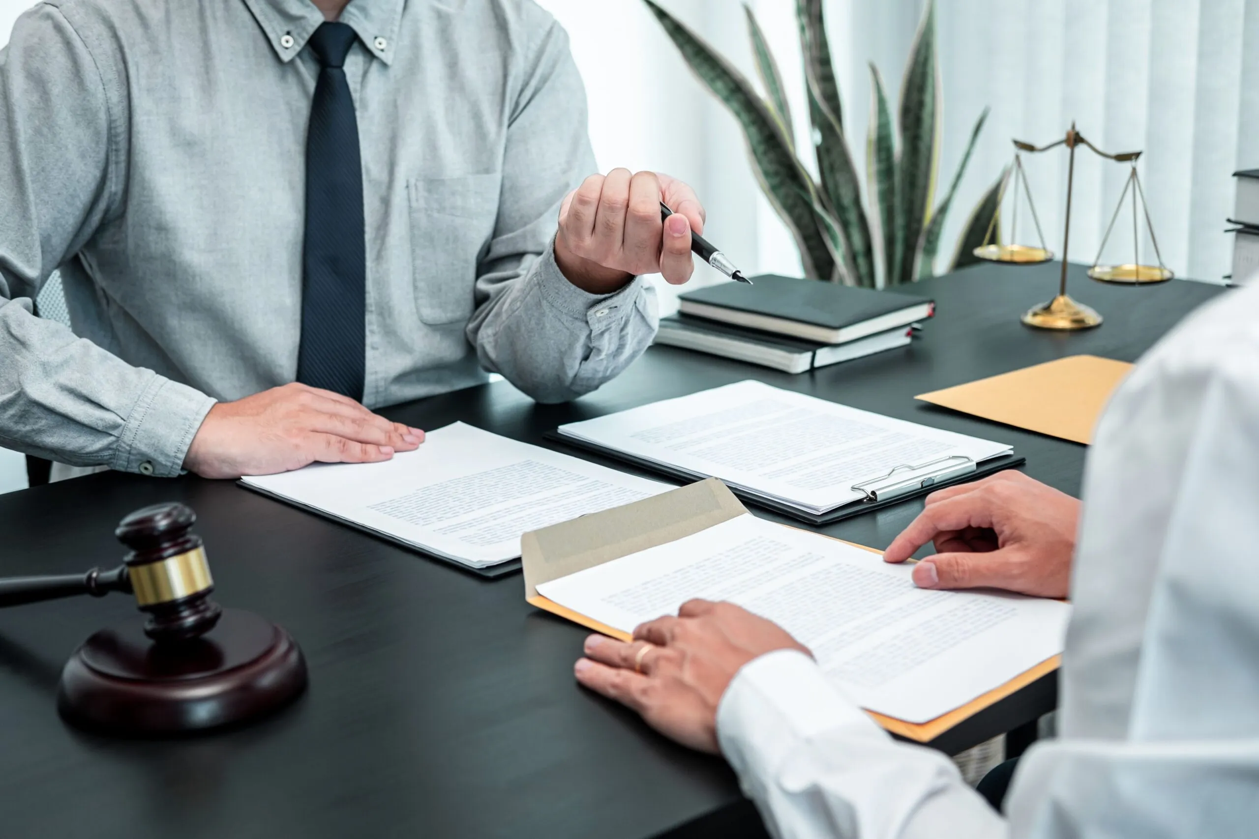 Attorney reviewing a catastrophic injury case file during a free consultation